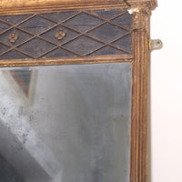 Close‑up of original foxed glass on antique gilt pier mirror