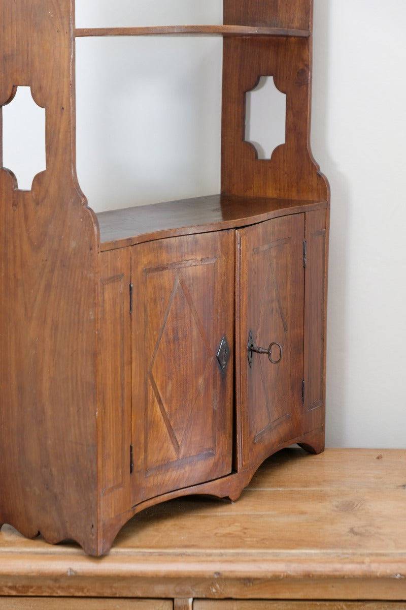 serpentine inlaid wall cabinet fruitwood