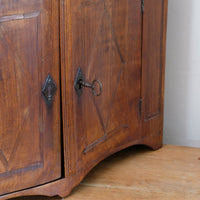original lock and key on antique cabinet
