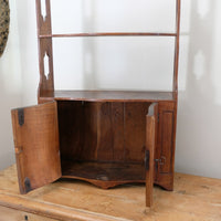 Open early nineteenth century serpentine cabinet