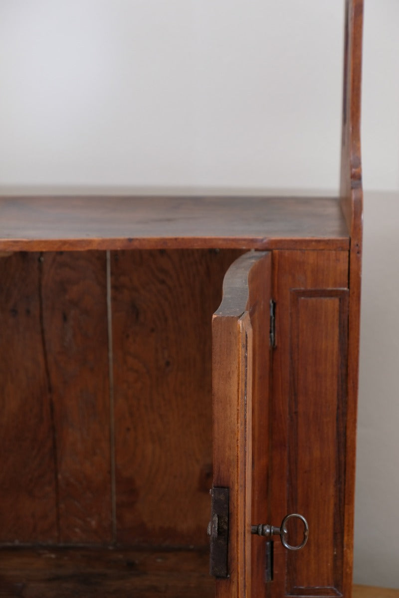 inside back of the serpentine inlaid wall cabinet fruitwood