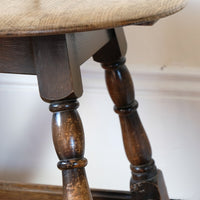1950s carved oak Priory low round stool table