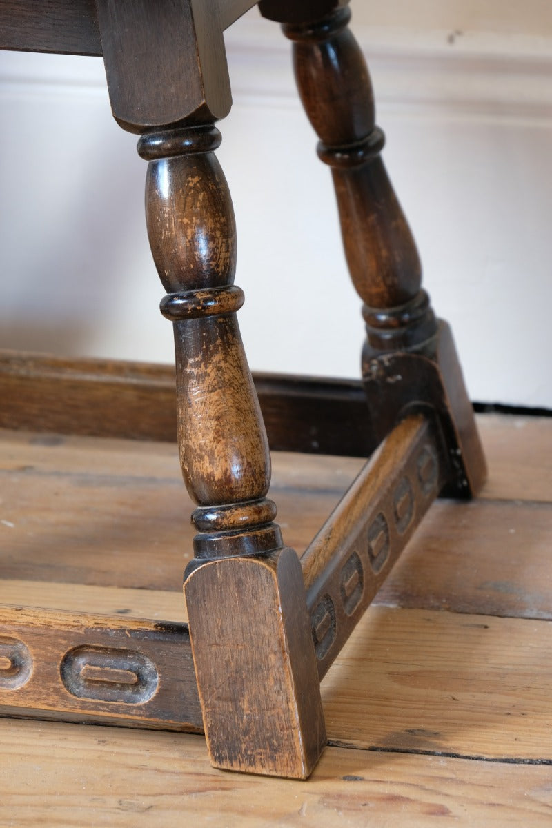 1950s carved oak Priory low round stool table