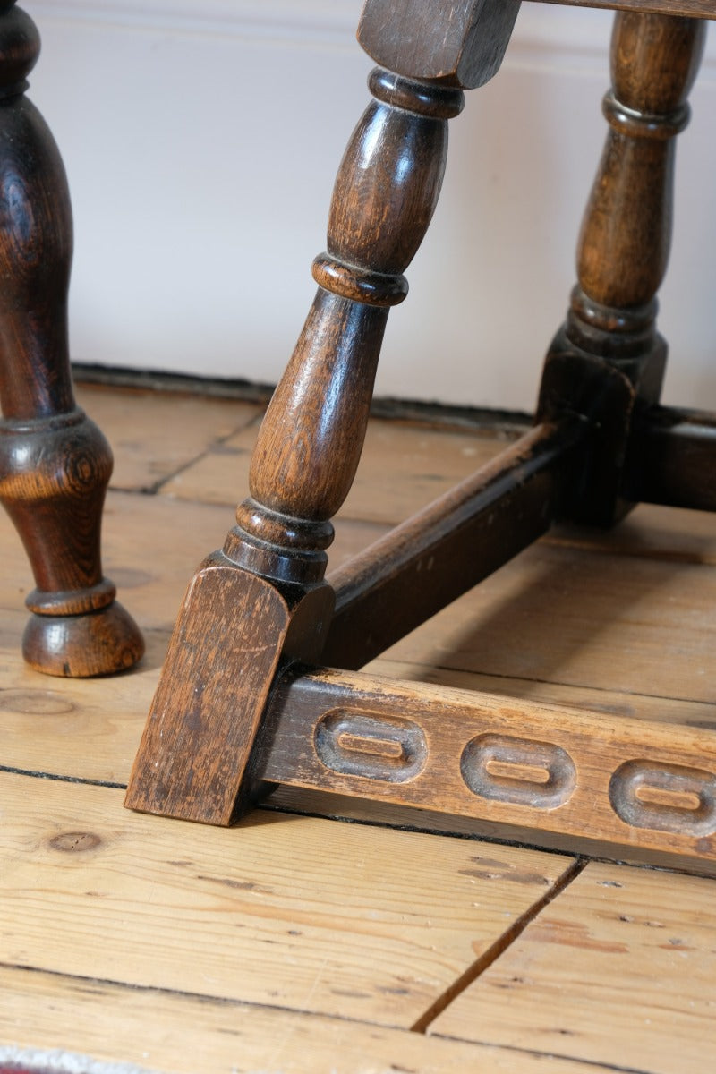 1950s carved oak Priory low round stool table