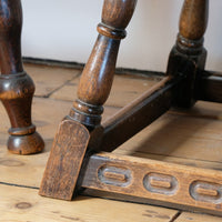 1950s carved oak Priory low round stool table