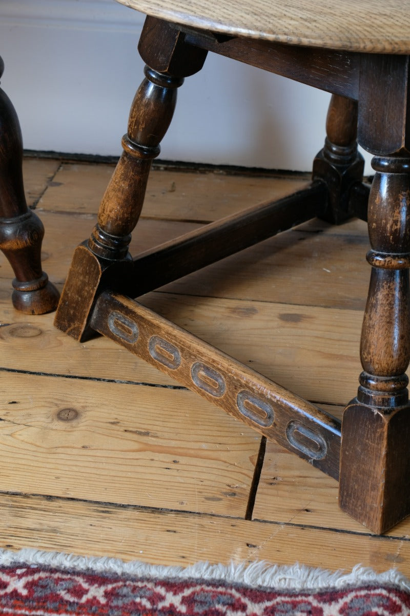 1950s carved oak Priory low round stool table