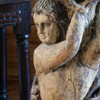 Antique carved polychrome putto pedestal with aged patina