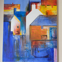 Abstract painting with blue and orange tones on a wall.