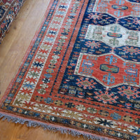 Caucasus Kazak wool rug with shield kazak medallions