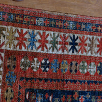 Kazak wool rug with shield kazak medallions