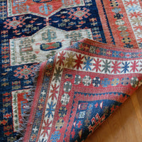 Kazak wool rug with shield kazak medallions
