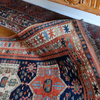 Kazak wool rug with shield kazak medallions