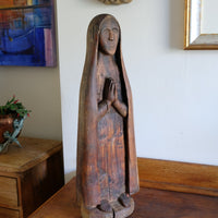 Antique carved sculpture statue of the Madonna