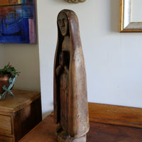 Antique carved sculpture statue of the Madonna