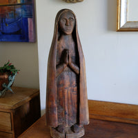 Antique carved sculpture statue of the Madonna