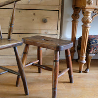 Antique elm and ash farmhouse stool with hand hole, circa 1860"
"Rustic 19th century wooden stool with turned baluster legs