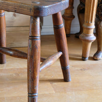 Antique elm and ash farmhouse stool with hand hole, circa 1860"
"Rustic 19th century wooden stool with turned baluster legs