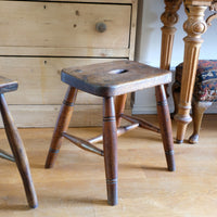 Antique elm and ash farmhouse stool with hand hole, circa 1860"
"Rustic 19th century wooden stool with turned baluster legs