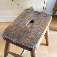 Antique elm and ash farmhouse stool with hand hole, circa 1860"
"Rustic 19th century wooden stool with turned baluster legs