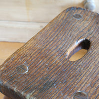Antique elm and ash farmhouse stool with hand hole, circa 1860"
"Rustic 19th century wooden stool with turned baluster legs