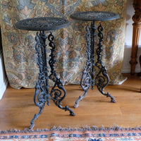 Antique ornate cast iron tripod tables circa 1900s matching pair