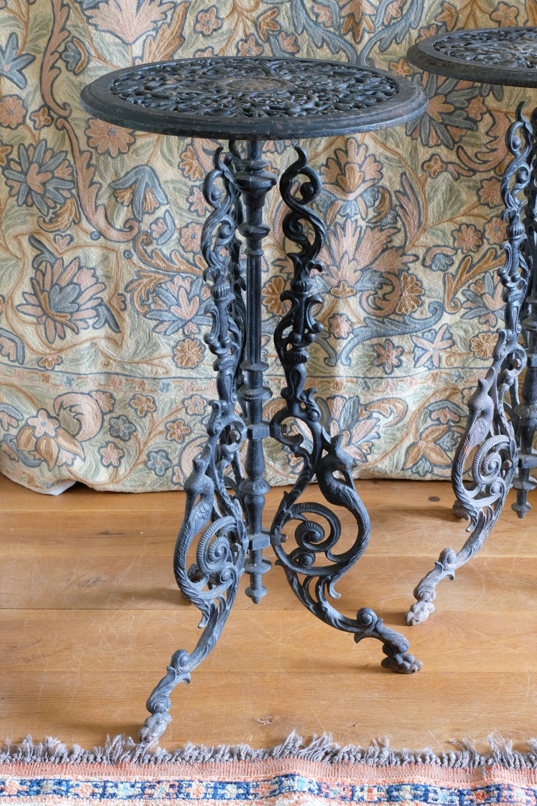 Antique ornate cast iron tripod tables circa 1900s matching pair