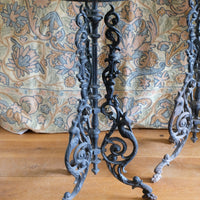 Antique ornate cast iron tripod tables circa 1900s matching pair