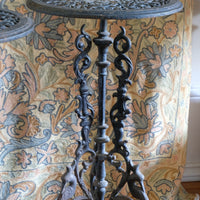 Pair of ornate cast iron tripod tables Circa 1900s
