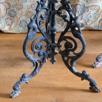 Antique ornate cast iron tripod tables circa 1900s matching pair