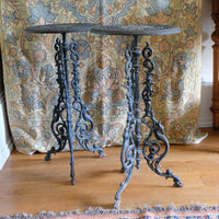 Antique ornate cast iron tripod tables circa 1900s matching pair