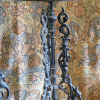 Antique ornate cast iron tripod tables circa 1900s matching pair