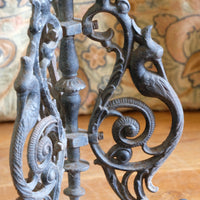 Antique ornate cast iron tripod tables circa 1900s matching pair