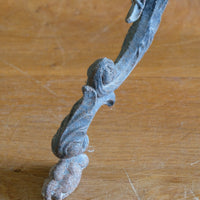 Antique ornate cast iron tripod tables circa 1900s matching pair