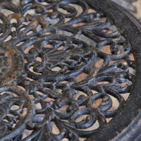 Antique ornate cast iron tripod tables circa 1900s matching pair