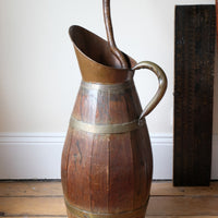 Large 19th-century oak and brass cider jug used as a walking stick and umbrella stand