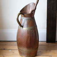Large 19th-century oak and brass cider jug used as a walking stick and umbrella stand