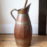 Large 19th-century oak and brass cider jug used as a walking stick and umbrella stand