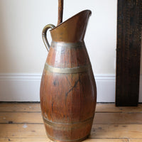 Large 19th-century oak and brass cider jug used as a walking stick and umbrella stand