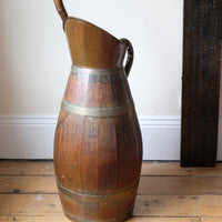 Large 19th-century oak and brass cider jug used as a walking stick and umbrella stand