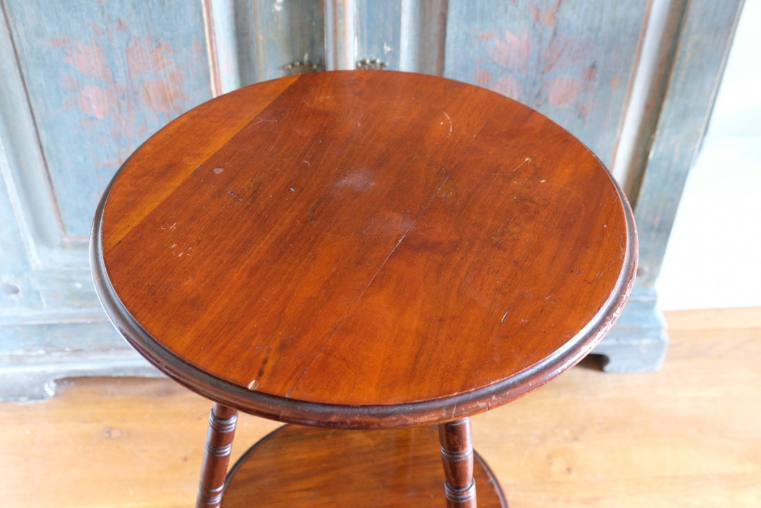 Close‑up of circular mahogany top turned edge