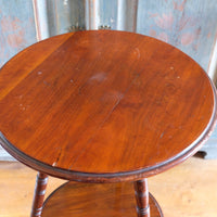 Close‑up of circular mahogany top turned edge
