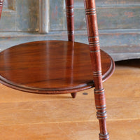 Detail of turned leg and lower shelf under tier