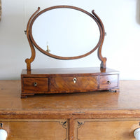 Flamed Mahogany Table Top Oval Mirror With Three Bow Fronted Drawers