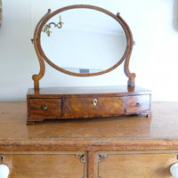 Flamed Mahogany Table Top Oval Mirror With Three Bow Fronted Drawers