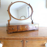Flamed Mahogany Table Top Oval Mirror With Three Bow Fronted Drawers