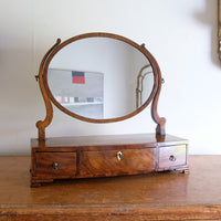 Flamed Mahogany Table Top Oval Mirror With Three Bow Fronted Drawers