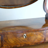 Flamed Mahogany Table Top Oval Mirror With Three Bow Fronted Drawers