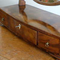 Flamed Mahogany Table Top Oval Mirror With Three Bow Fronted Drawers