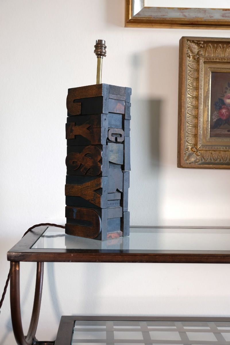 Close‑up of printing block letters forming lamp base