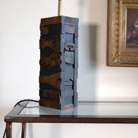 Close‑up of printing block letters forming lamp base